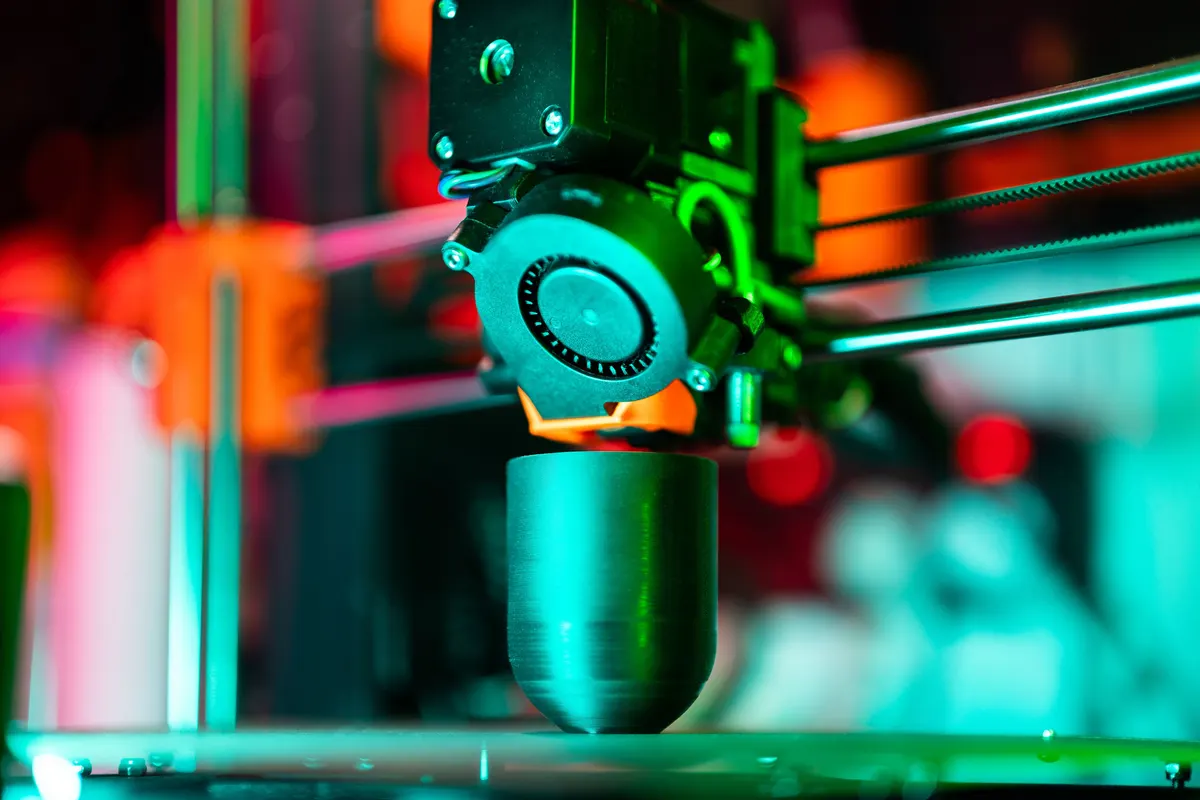 A 3D printer part way through printing one of the best 3D printed dog accessories
