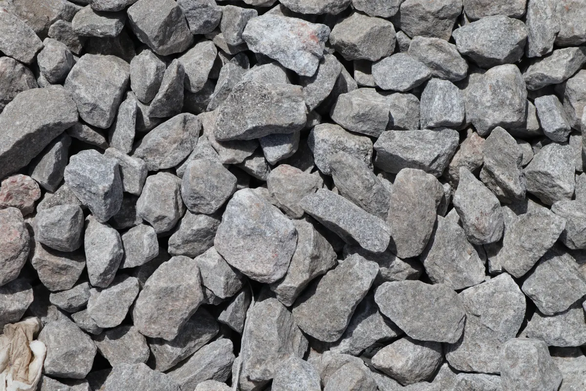 Gravel and stone yard, a no grass dog friendly backyard idea